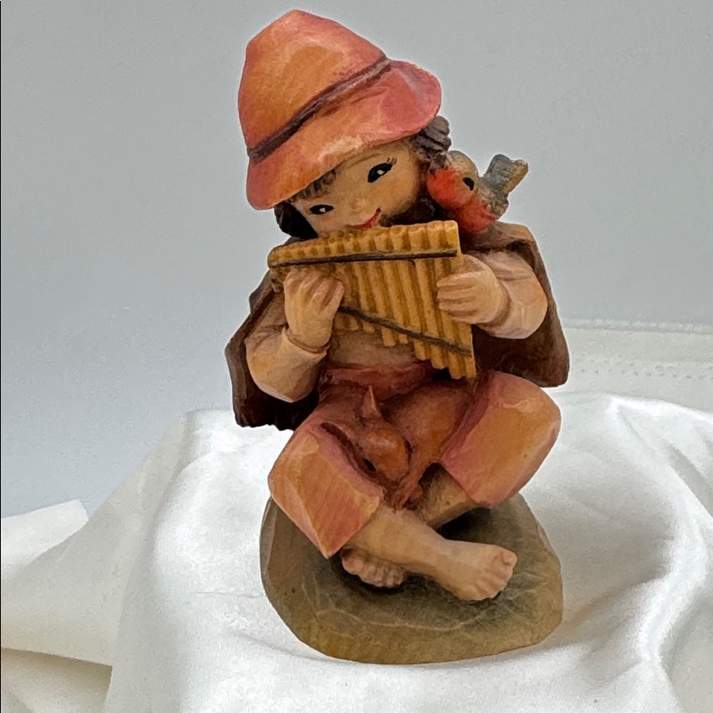 Anri hand carved wood figurine  "Harmony" featuring a boy playing a flute; 4.25”
